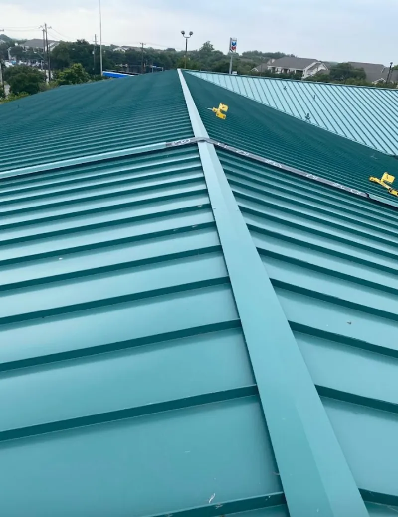 Green commercial metal roof ridge and valley for Metal Roof Repair in Spearfish