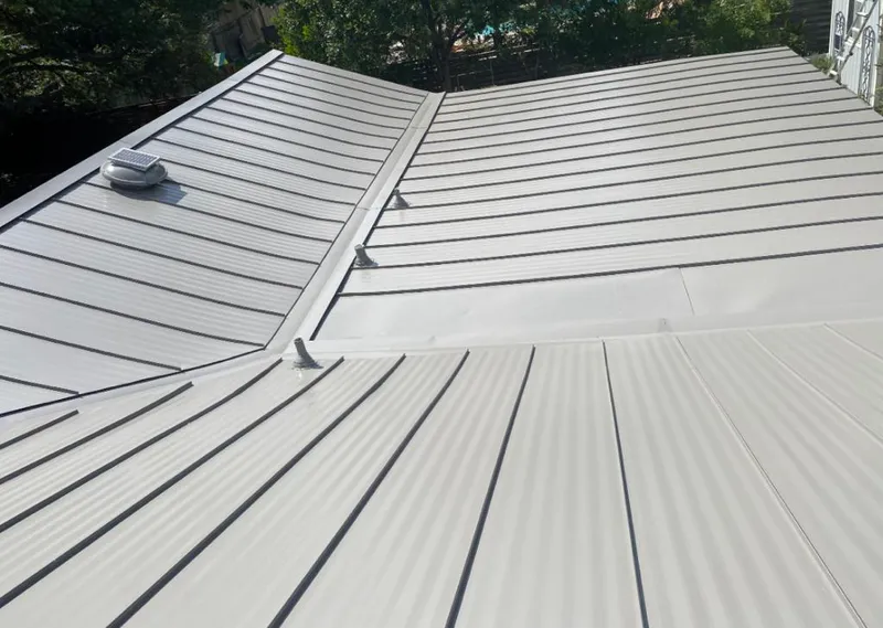 Solar attic fan installed on a metal roof for Roof Ventilation in Spearfish